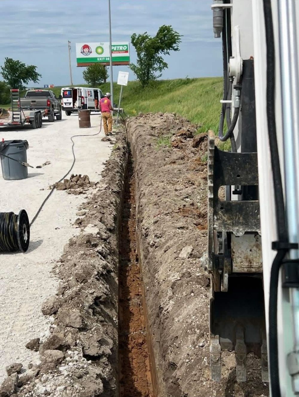300 foot electrical trench along a gravel lot